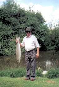 A member Proudly holding his 14LB salmon